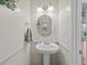 Half bathroom featuring tiled flooring and modern sink at 19 Meadowlake Ct, Winter Haven, FL 33884