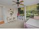 Bedroom with mural wall, ceiling fan and pink twin bed at 19 Meadowlake Ct, Winter Haven, FL 33884