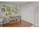 Playful bedroom features hardwood floors, white storage unit, and white closet doors at 19 Meadowlake Ct, Winter Haven, FL 33884