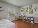 Bright bedroom with hardwood floors, desk and workspace, and colorful decor at 19 Meadowlake Ct, Winter Haven, FL 33884