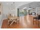 Bright dining room with skylights, an open floor plan, and easy access to outdoor pool at 19 Meadowlake Ct, Winter Haven, FL 33884