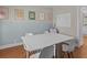 Dining area featuring laminate flooring, retro mini fridge and modern table at 19 Meadowlake Ct, Winter Haven, FL 33884