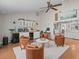 Cozy sitting area with leather chairs, a ceiling fan, and wet bar is ideal for relaxation at 19 Meadowlake Ct, Winter Haven, FL 33884