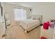 Bedroom featuring a large window for natural light and a stylish full-length mirror at 2029 Maple Ridge Dr, Zellwood, FL 32798