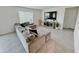 Living room featuring tile floors, a large sofa, and a bright window at 2029 Maple Ridge Dr, Zellwood, FL 32798