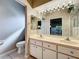 Bright bathroom with double sink vanity and tile flooring at 21636 King Henry Ave, Leesburg, FL 34748