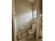 Small toilet room features a standard toilet, and tile flooring at 21636 King Henry Ave, Leesburg, FL 34748