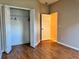 Bright bedroom with closet and doorway at 21636 King Henry Ave, Leesburg, FL 34748