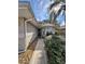 Exterior view of the front entrance, landscaped with decorative rocks and greenery at 21636 King Henry Ave, Leesburg, FL 34748