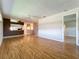 Open-concept living room featuring hardwood floors and ample natural light at 21636 King Henry Ave, Leesburg, FL 34748