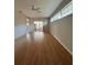 Bright living room featuring lots of natural light, sliding glass door, and wood-look floors at 21636 King Henry Ave, Leesburg, FL 34748