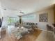 Bright living room with a neutral palette, modern decor, and views to the dining area at 21636 King Henry Ave, Leesburg, FL 34748