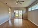 Spacious living room with wood floors and fan at 21636 King Henry Ave, Leesburg, FL 34748