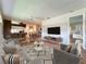 Open living room layout with laminate floors and views to the kitchen and dining area at 21636 King Henry Ave, Leesburg, FL 34748