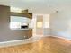 Bright living space with a pass through to the kitchen and laminate floors at 21636 King Henry Ave, Leesburg, FL 34748