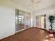 Enclosed patio featuring tile flooring, sliding glass doors, and peaceful outdoor view at 21636 King Henry Ave, Leesburg, FL 34748