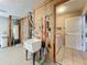 Spacious utility room equipped with a sink, water heater, and laundry hookups at 21636 King Henry Ave, Leesburg, FL 34748