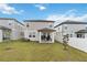 Exterior backyard view featuring a patio, fenced yard, and the home's siding at 2242 Huntsman Ridge Rd, Clermont, FL 34715