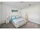 Cozy bedroom with neutral carpet, white walls, and a comfortable queen-sized bed at 2242 Huntsman Ridge Rd, Clermont, FL 34715