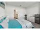 Bright bedroom featuring light carpet and decor, with a closet visible and ensuite bathroom at 2242 Huntsman Ridge Rd, Clermont, FL 34715