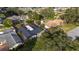 Aerial view of a residential property with a screened-in pool and well-maintained landscaping at 2555 Sweetwater Trl, Maitland, FL 32751