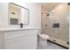 A modern bathroom includes a glass shower, black fixtures and a white vanity at 2555 Sweetwater Trl, Maitland, FL 32751