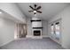 Living room features white brick fireplace with dark wood mantle and view of outdoor pool at 2555 Sweetwater Trl, Maitland, FL 32751