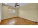 Bedroom with wood parquet floors and a ceiling fan at 2642 Tierra Cir, Winter Park, FL 32792