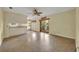 Open dining area with tan flooring, natural lighting, and access to kitchen and outdoor area at 2642 Tierra Cir, Winter Park, FL 32792