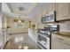 Stylish kitchen with plenty of counter space, stainless steel appliances and great natural lighting at 2642 Tierra Cir, Winter Park, FL 32792