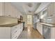 Galley kitchen with stainless steel appliances, ample cabinet space, and granite countertops at 2642 Tierra Cir, Winter Park, FL 32792