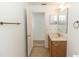 Bathroom featuring a wood grain vanity, perfect for a house guest at 2645 Coachman Dr, Deltona, FL 32738