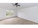 This bedroom features a large window that offers a view at 2645 Coachman Dr, Deltona, FL 32738