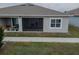 The rear of the house has a large, screened-in porch that overlooks a pond at 2821 Sunridge Loop, St Cloud, FL 34771