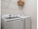 Modern laundry room featuring a front loading Samsung washer and dryer at 2821 Sunridge Loop, St Cloud, FL 34771