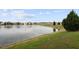 Beautiful view of the pond with fountain and well-manicured landscaping at 2821 Sunridge Loop, St Cloud, FL 34771