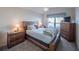 Comfortable bedroom with bright light, wooden furniture and a large window at 2936 Suber St, The Villages, FL 32163