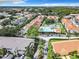 An aerial view of the community showing the pool, tennis courts, and lush landscaping at 3208 Sabal Palms Ct # A, Kissimmee, FL 34747