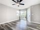 Bedroom features wood floors, sliding glass doors and patio access at 3208 Sabal Palms Ct # A, Kissimmee, FL 34747