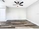 A bedroom with gray walls, wood floors, and double-door closet at 3208 Sabal Palms Ct # A, Kissimmee, FL 34747