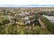 An aerial shot of the pool, pond and residential buildings in the community, surrounded by lush trees at 3257 Villa Strada Way, Orlando, FL 32835