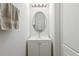 Bright bathroom featuring a white vanity with oval mirror and decorative lighting at 3257 Villa Strada Way, Orlando, FL 32835