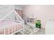 Charming bedroom with pink walls, a cozy bed, and playful decor at 3257 Villa Strada Way, Orlando, FL 32835