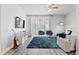 Bright living room with large windows, blue rug, modern furniture and a ceiling fan at 3257 Villa Strada Way, Orlando, FL 32835