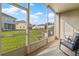 View from the screened-in patio shows a green backyard at 3257 Villa Strada Way, Orlando, FL 32835