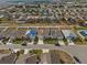 Aerial view of a residential neighborhood showcasing similar single Gathering homes at 337 Regency Ridge Dr, Davenport, FL 33837