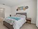 Relaxing bedroom featuring a queen-size bed, decorative wall art, and calming decor at 337 Regency Ridge Dr, Davenport, FL 33837