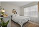 Cozy bedroom with a queen-size bed, decorative wall art, and ample natural light at 337 Regency Ridge Dr, Davenport, FL 33837