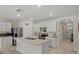 Modern kitchen featuring white cabinetry, stainless steel appliances, and an island with sink at 337 Regency Ridge Dr, Davenport, FL 33837