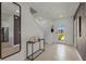 Welcoming foyer with neutral tile flooring, a console table, and a view of the staircase at 3374 Private Oak Dr, Apopka, FL 32703